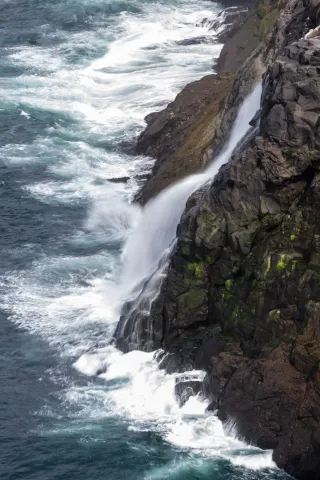 Lake Leitisvatn, which flows over a waterfall into the North Atlantic